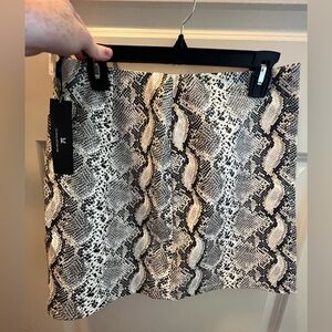 Faux Snake skin leather skirt. New with tags